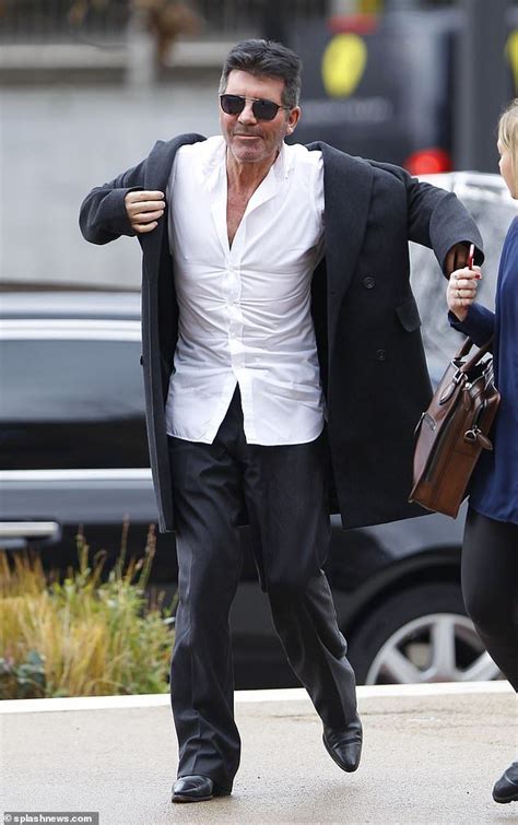 simon cowell showcases his slimmed down physique on outing in london fashion crisp white