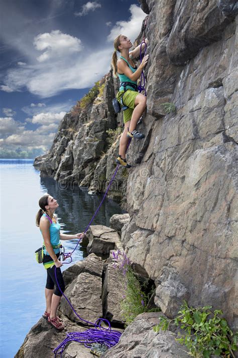 Group Of Female Rock Climbers Makes And Ascent On Stock Image Image