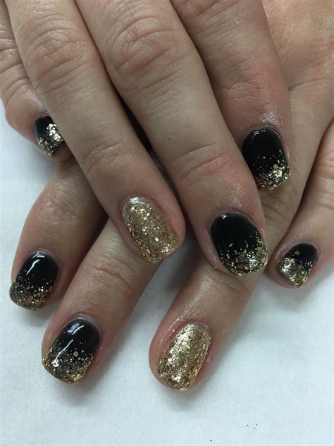 Ring In The New Year With Fabulous Black And Gold New Years Nails The