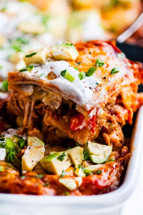 This layered chicken enchilada casserole is ready in just 35 minutes, a snap to make, super yummy and kid friendly. Cheesy Red Chicken Enchilada Casserole - Aberdeen's Kitchen
