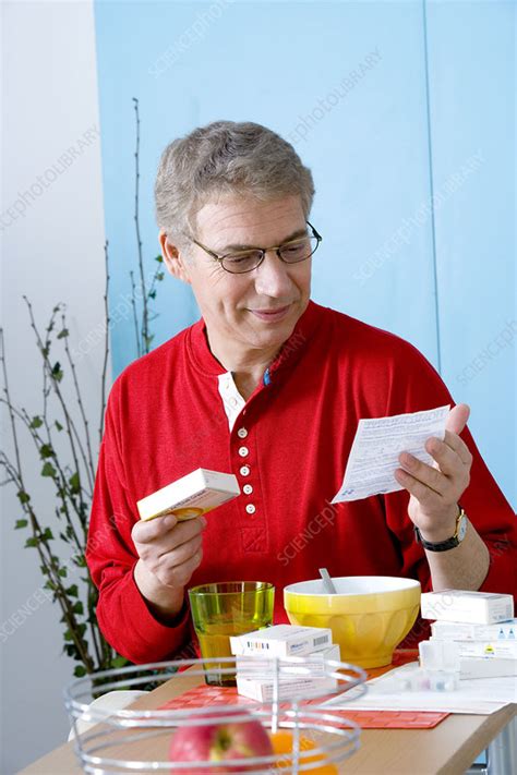 Elderly Person Taking Medication Stock Image C0020714