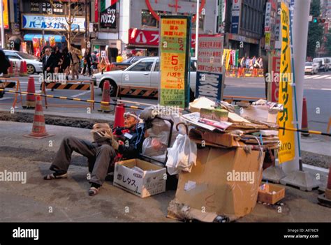Japan Honshu Tokyo Homeless Man Living On The Street With His Cardboard