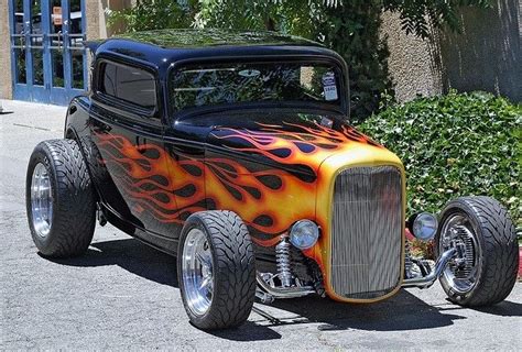 An Orange And Black Car With Flames On It