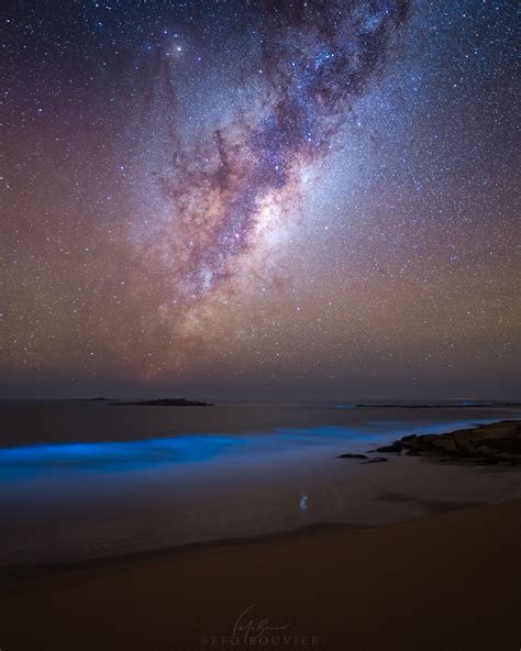 The Milky Way Above A Glowing Bioluminescent Ocean R