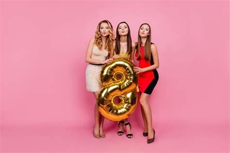 Full Length Portrait Of Three Pretty Funny Girls Blowing Kiss To The
