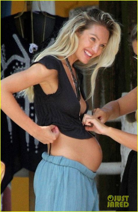 Candice Swanepoel Shows Off Her Baby Bump At The Beach Photo