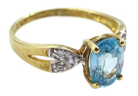Ds 9ct Gold Oval Blue Zircon Ring With White Zircon Set Shoulders