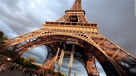 The Eiffel Tower In Paris France With An Overcast Sky Behind It