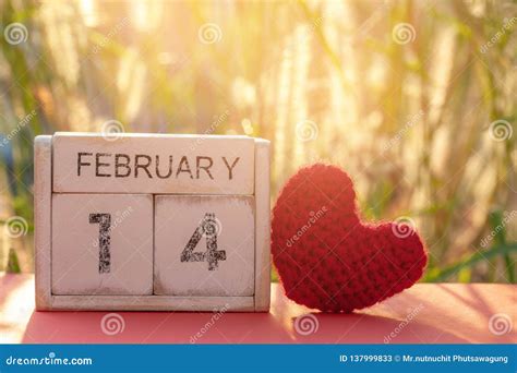 Wooden Calendar Show Of February 14 With Pink Heart Valentine`s Day