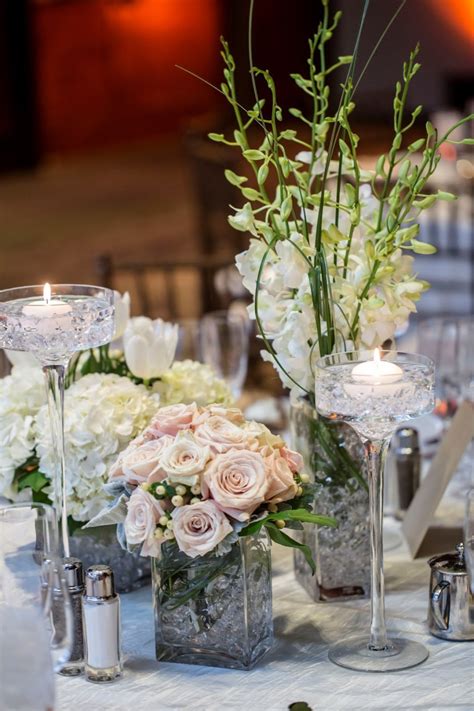 A much more simple floral centerpiece, with two. 18 Great Tall Clear Glass Vases for Weddings | Decorative ...