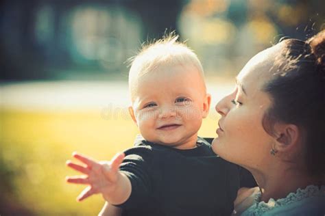 Mom And Baby Boy Outdoor Mother Hug Little Son With Love Woman With