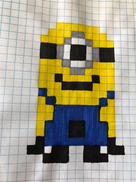 A Piece Of Art Made To Look Like A Minion Sitting On Top Of A Sheet Of
