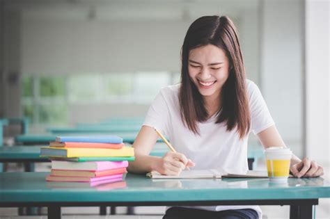 Free Stock Photo Of Smiling Student Studying Download Free Images And