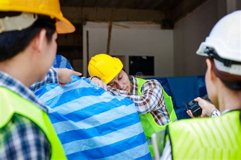 Engineer Holding A Radio To Report The Work Of A Construction Worker