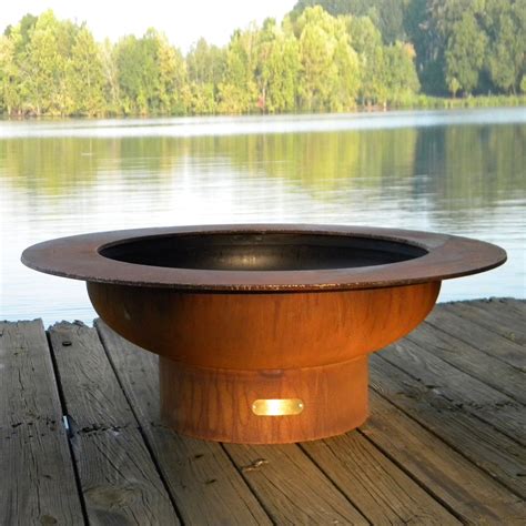 Sure to please, these wonderful backyard fire pits. Shop Fire Pit Art 40-in W Iron Oxide Patina Steel Wood ...
