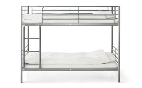 With one bed safely stacked above the other, two people can occupy the same sleeping space. The silver metal IKEA bunk bed, SVÄRTA, with white bedding ...