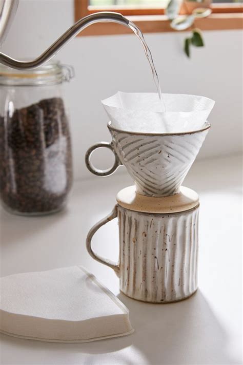 Fold the filter into a cone shape and rinse it in the hario dripper with water just off the boil (about 205°f) to eliminate paper flavor and to heat up the mug or carafe you are brewing into. Hario V60 Coffee Filter Set | Coffee filters, V60 coffee ...