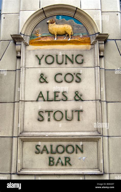 Saloon Bar And Young And Cos Ales And Stouts Signs And Image Of A Ram