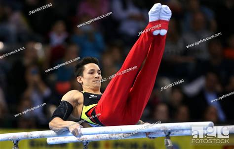 Marcel Nguyen From Germany In Action At The Parallel Bars During The