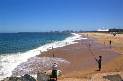 City Skyline And Beach Fishermen In Durban Editorial Stock Image