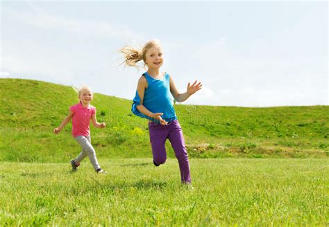 Group Of Happy Kids Running Outdoors Stock Photo Image Of Girls