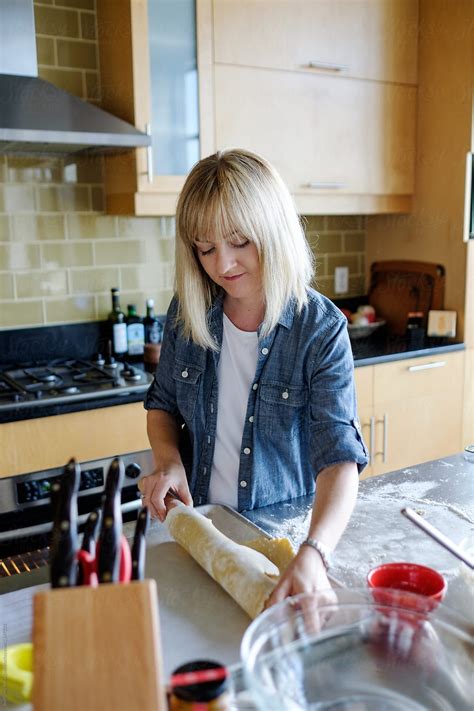 Woman Rolling Dough To Make An Apple Pie By Stocksy Contributor Take A Pix Media Stocksy