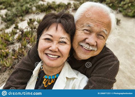 Happy Mature Couple Hugging On Beach Stock Image Image Of Asian Adult 206871251