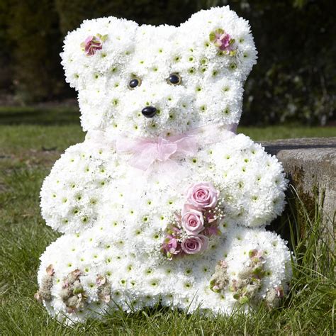 You may choose to simply send a bear with roses to your beloved too if you prefer. Teddy Bear floral tribute created by Lambert's Flower ...