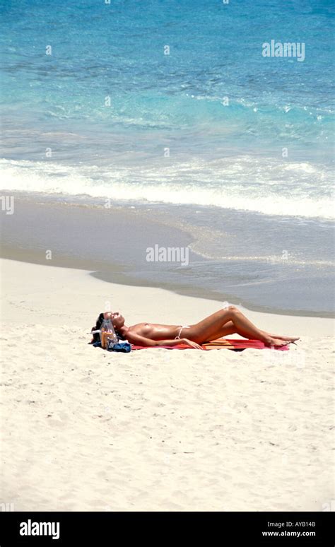 Sunbathing Topless In The French Caribbean St Barthelemy Stock Photo
