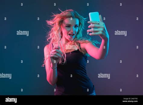 Caucasian Young Womans Portrait On Gradient Background In Neon Light