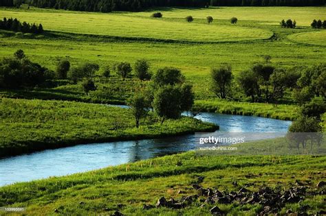 River On Grassland High Res Stock Photo Getty Images
