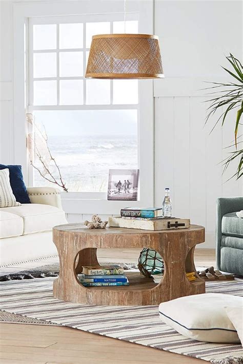 Features one (1) drawer and open storage with bottom shelf; Modern rustic coffee table with cutouts. Made to resemble ...