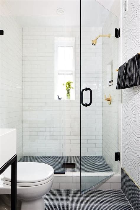 They give a cleaner look without the feeling of penny tiles are extremely small bathroom tiles. Black and white shower designed with mini black penny ...