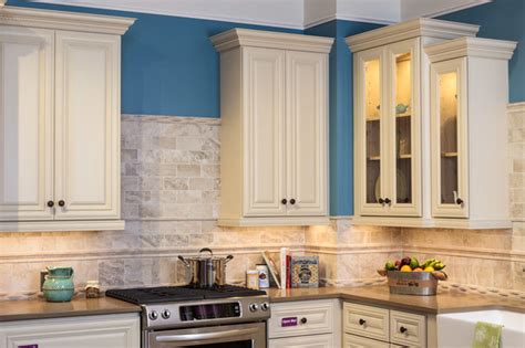 Featuring raised panels and applied moldings these cabinets create an intimate vibe in your living space. Victoria Ivory Kitchen Cabinets - Traditional - Baltimore ...