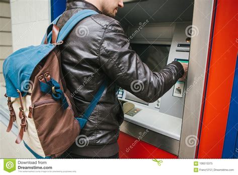 It can hurt your credit score, put off prospective lenders who see cash advances in your credit report, and cost you money in fees and higher interest rates. The Tourist Withdraws Money From The ATM For Further Travel. Grabs A Card From The ATM. Finance ...