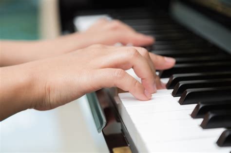 Close Up Of Hands Playing Piano Photo Free Download