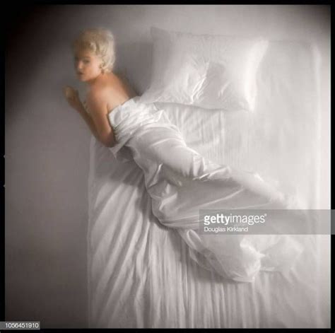 Portrait Of American Actress Marilyn Monroe As She Lies On A Bed