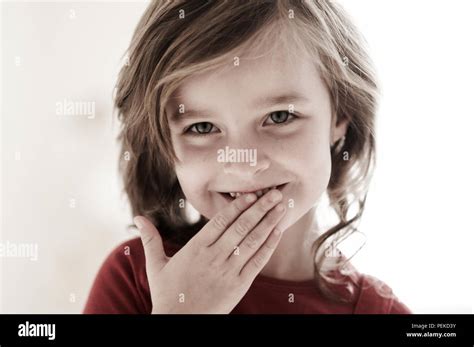 Close Up Of An Innocent Little Girl Giggling Stock Photo Alamy