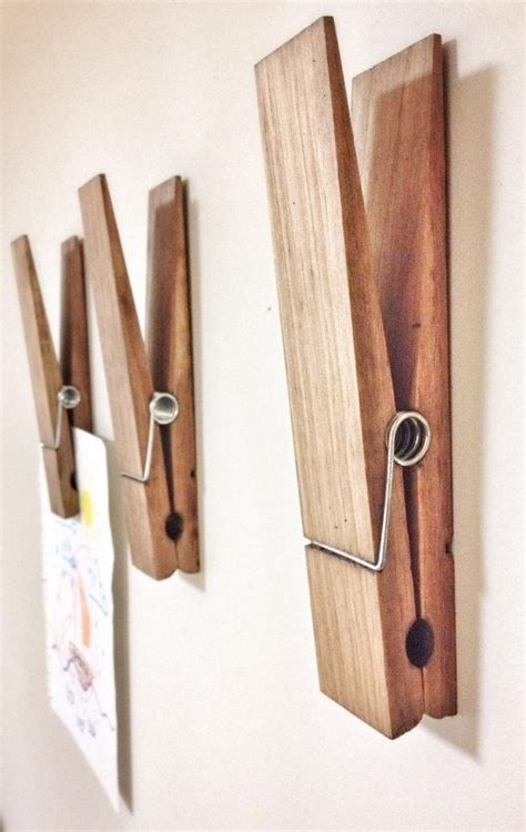 two wooden pegs are attached to the wall