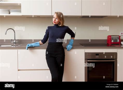 Woman Leaning Against Kitchen Cabinet Hi Res Stock Photography And