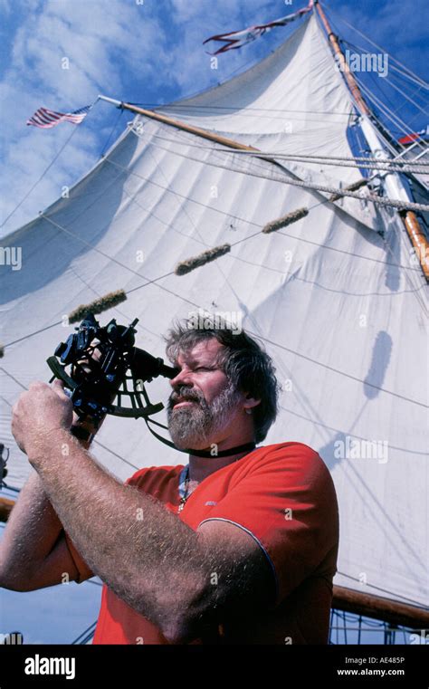 A Sailor Collects A Navigational Sun Line On A Sextant Of The Square Rigged Sailing Ship Elissa