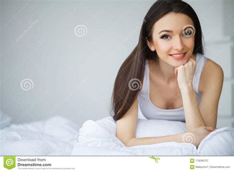 Young Beautiful Woman Lying On Bed Stock Image Image Of Female Home