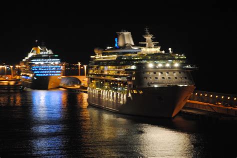 Cruise Ships At Night In Barcelona And Civitavecchia