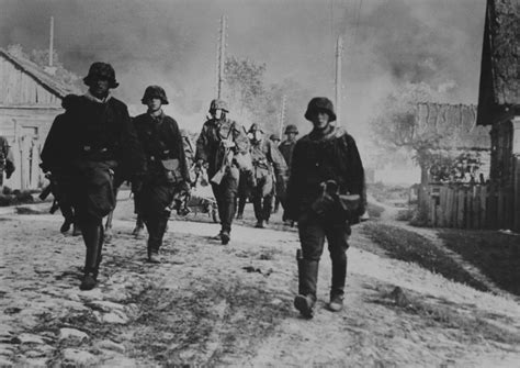Men Of Wehrmacht Das Reich Soldiers Marching Through The Burning