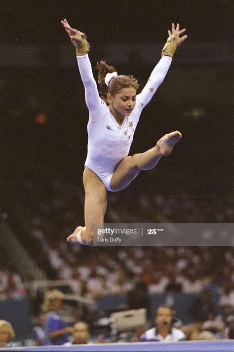 Gymnast Dominique Moceanu Of The Usa Jumps In The Womens All Around Gymnastics Olympic
