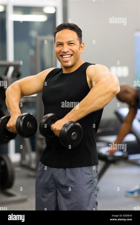 Cheerful Muscular Man Exercise With Dumbbells Stock Photo Alamy