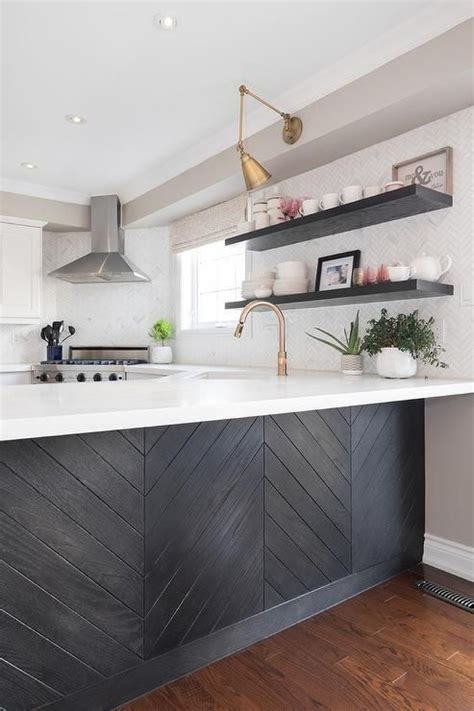 Because we target all types of customer on the market. Black wood herringbone trim accents a kitchen peninsula ...