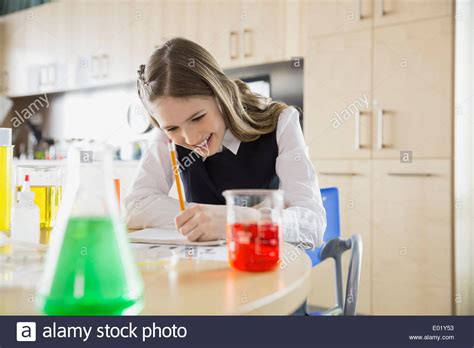 School Girl Conducting Experiment In Science Classroom Stock Photo Alamy