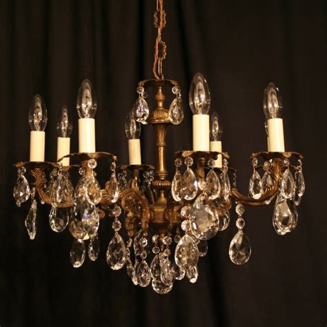 The entire structure is finished in an antique brass tone and is constructed with a seamless design. An Italian Gilded Cast Brass 8 Light Antique Chandelier ...