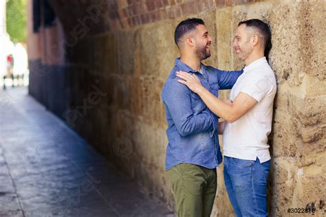 Gay Couple Hugging In A Romantic Moment Outdoors Stock Photo Crushpixel